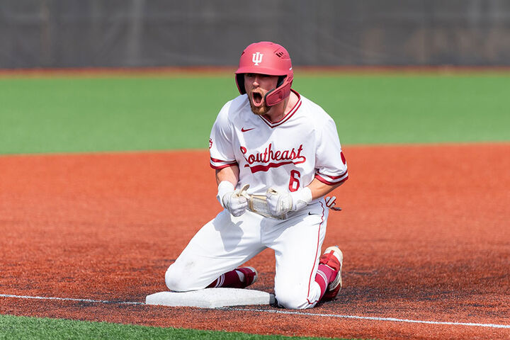 An IU Southeast baseball player celebrates on second base.